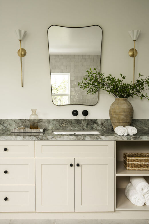 Powder room with floating marble vanity