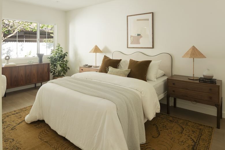 Bedroom with scalloped headboard